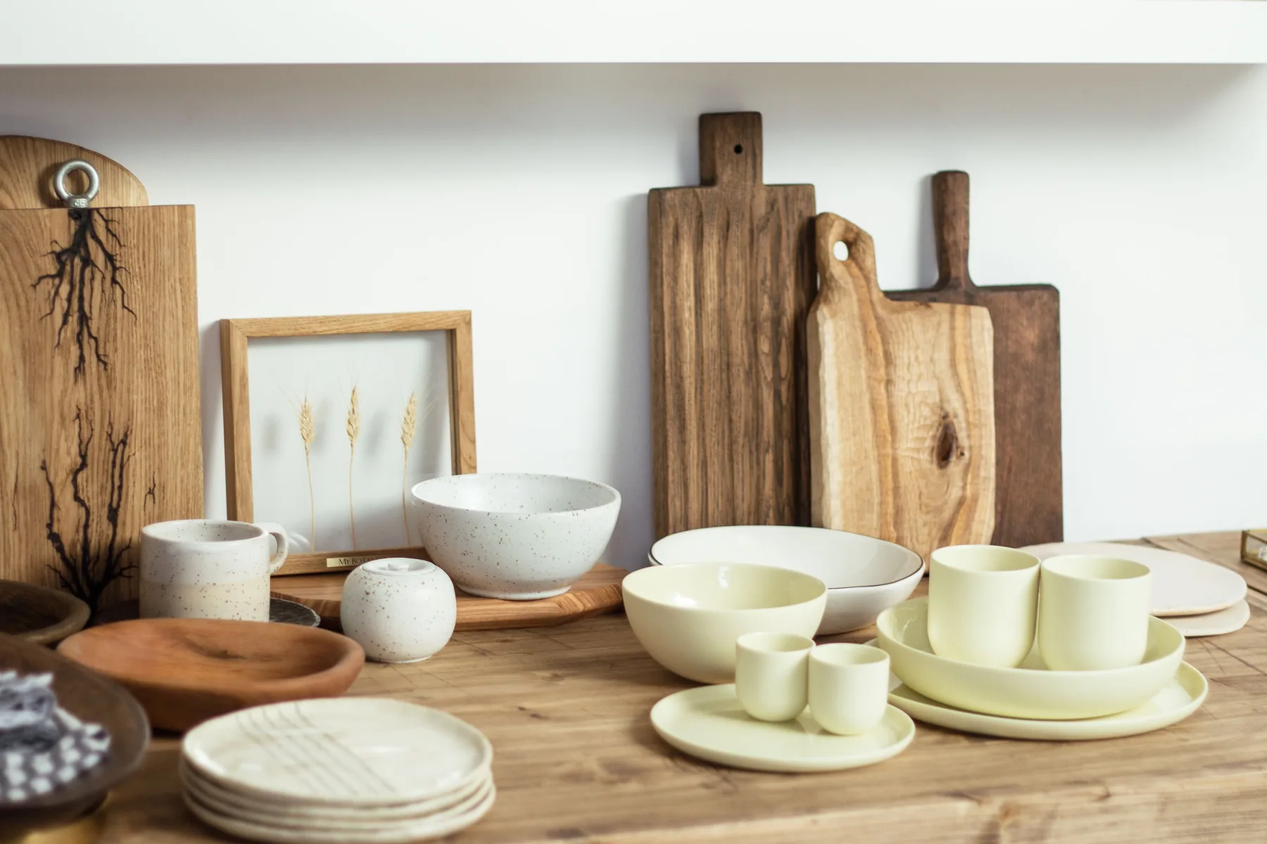 Ceramic tableware and wooden boards representing everyday objects